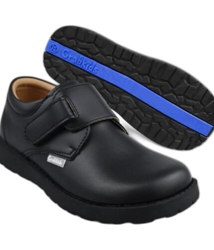 Boys' black school shoes with a padded single velcro strap and blue-trim sole