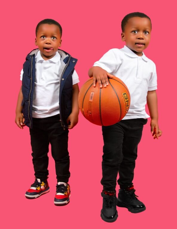 Two boys in sports shoes from Kicks and Packs