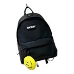Kids' black nylon backpack with a front graphic patch and a yellow smiley charm