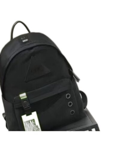 Kids' black nylon backpack with a neon yellow luggage tag