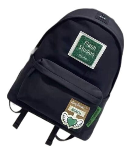Kids' navy nylon school backpack with a green front patch and winged heart badges