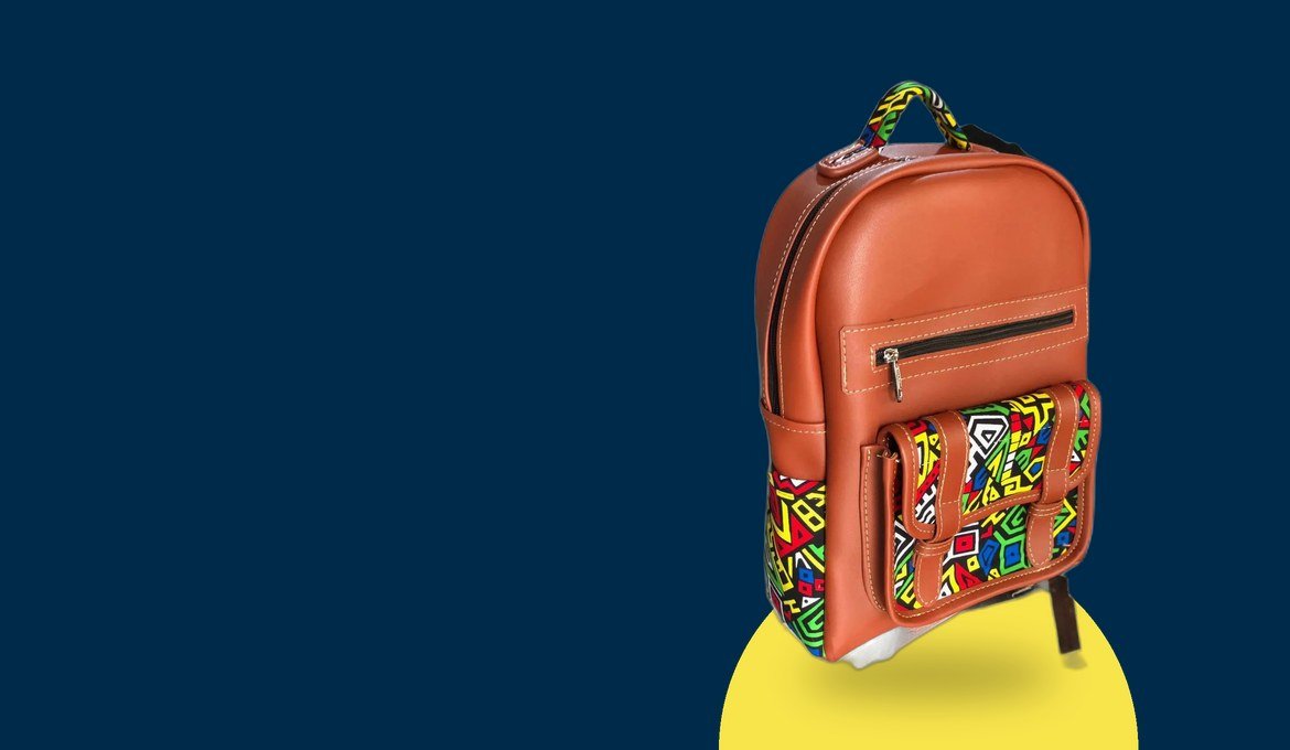Handmade kitenge leather backpack on a navy promotional panel